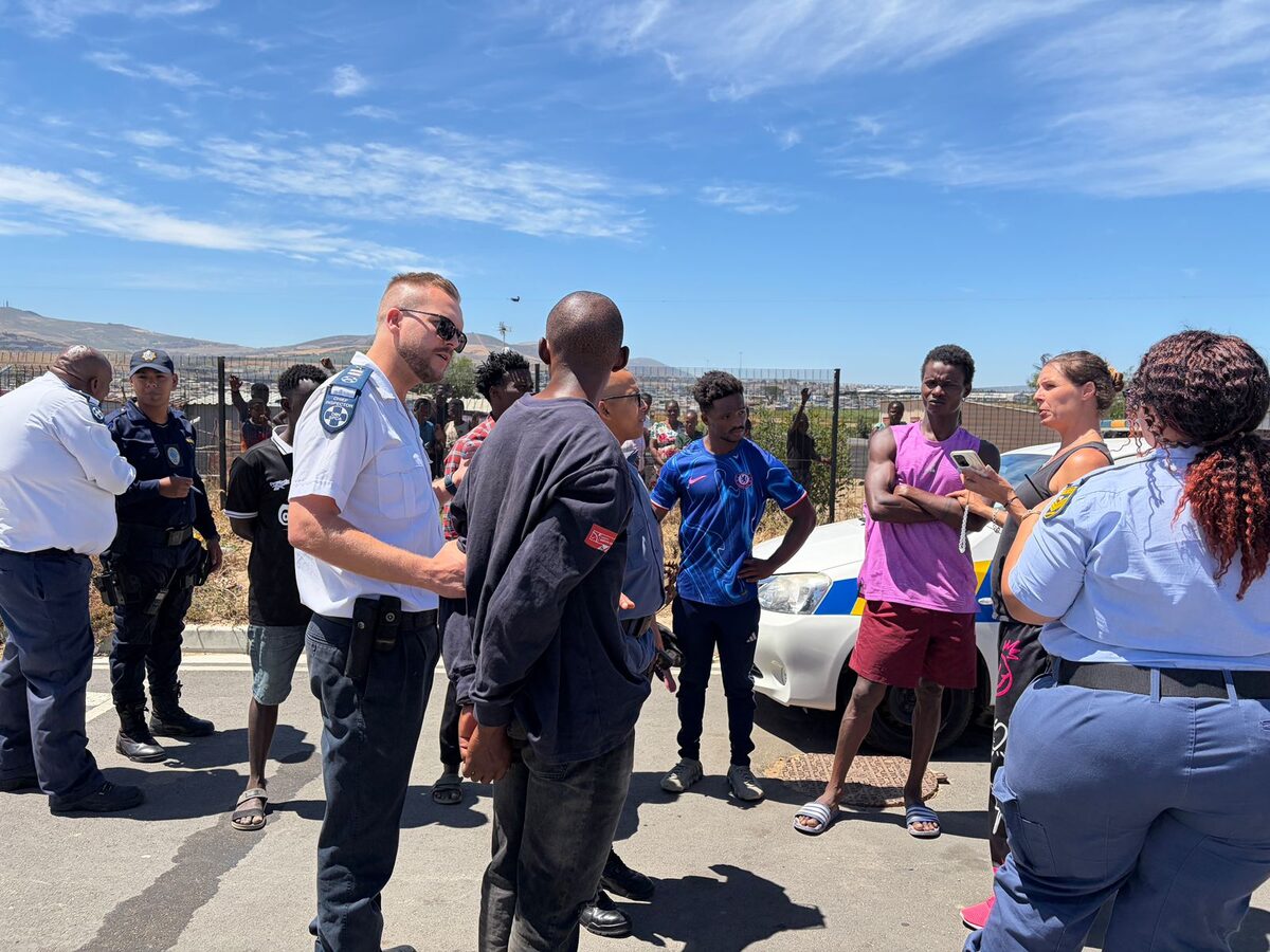 Dunoon residents help restrain fugitive puppy seller before authorities arrive.