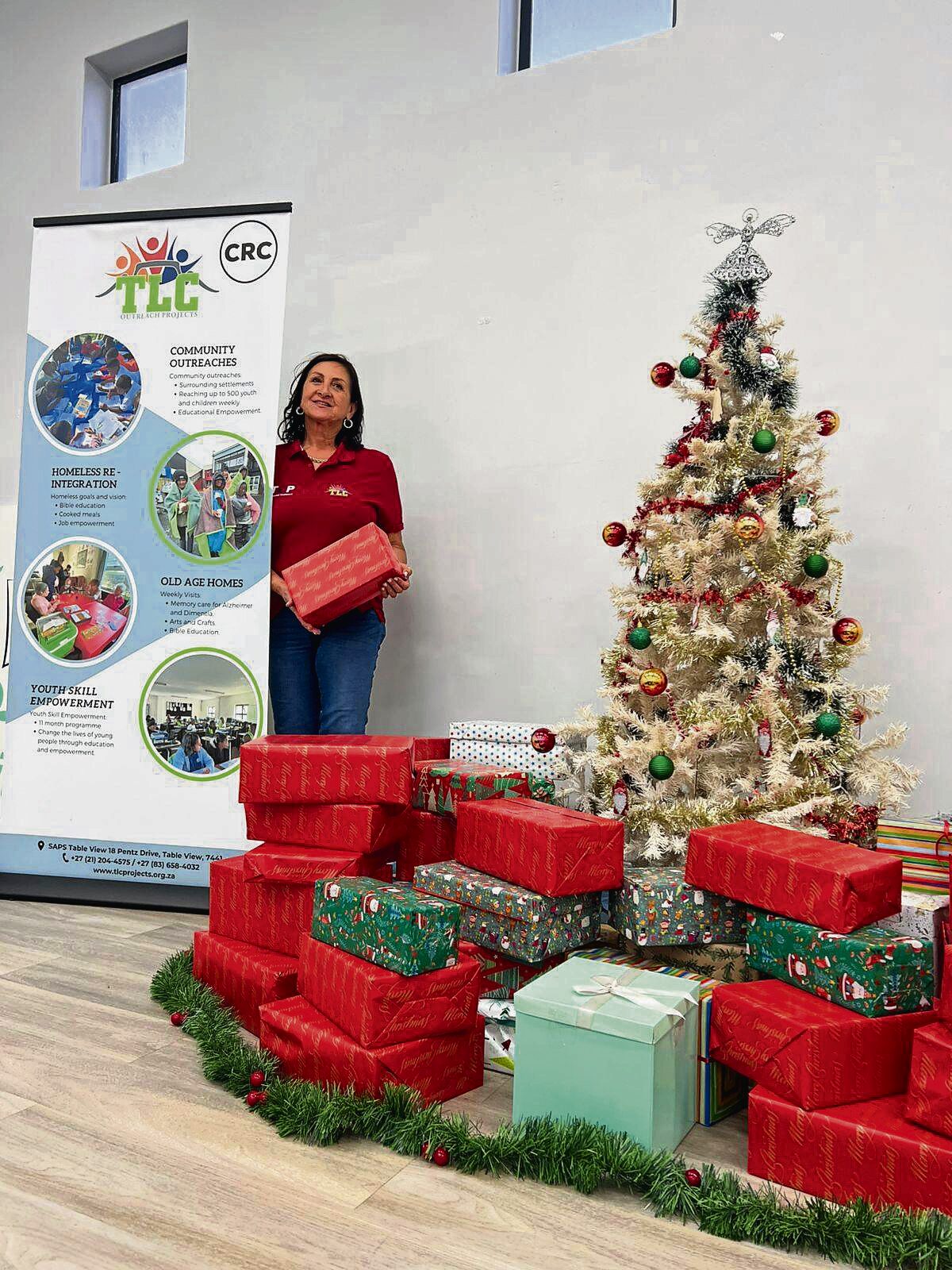
Colleen Petersen pictured with the Christmas presents.