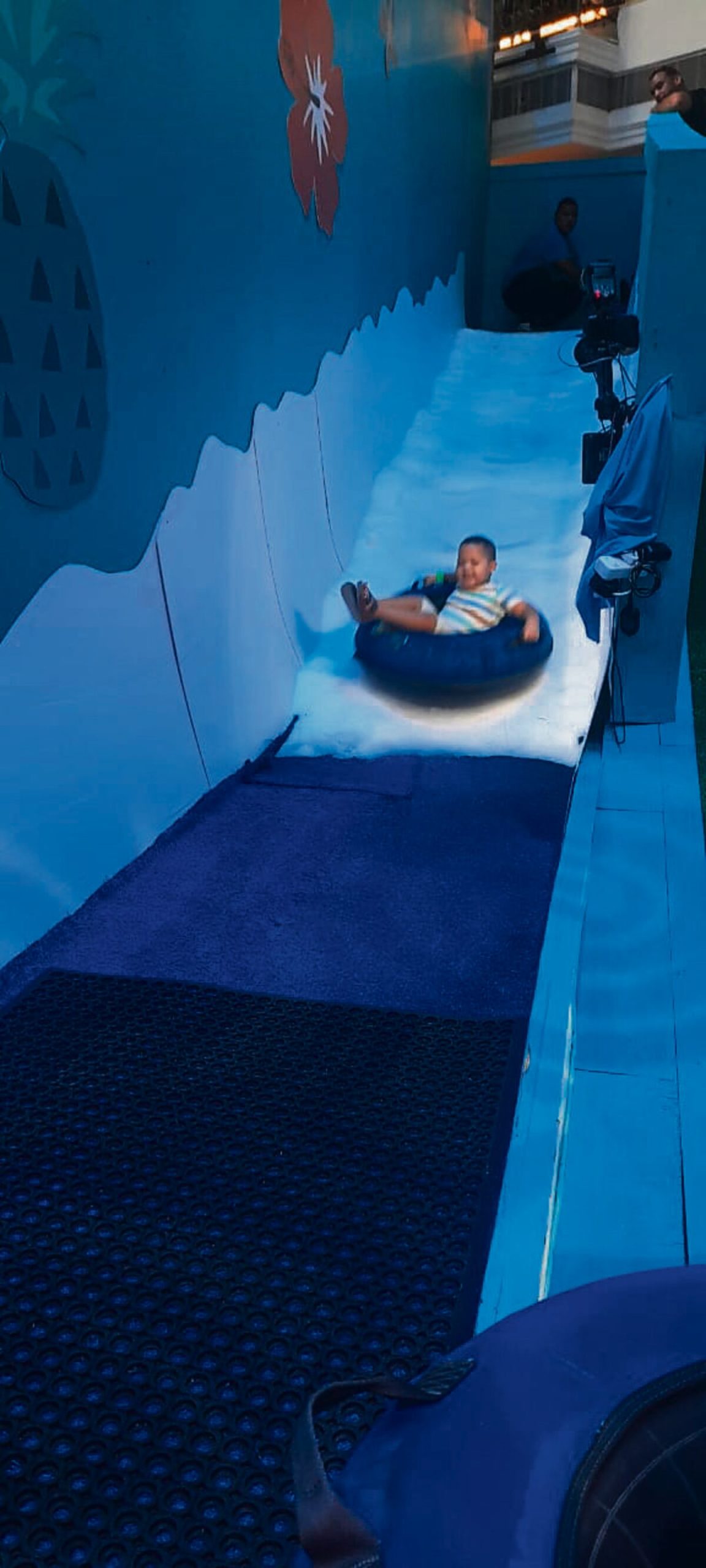 Kayden Treadway (3) on the mini slide.