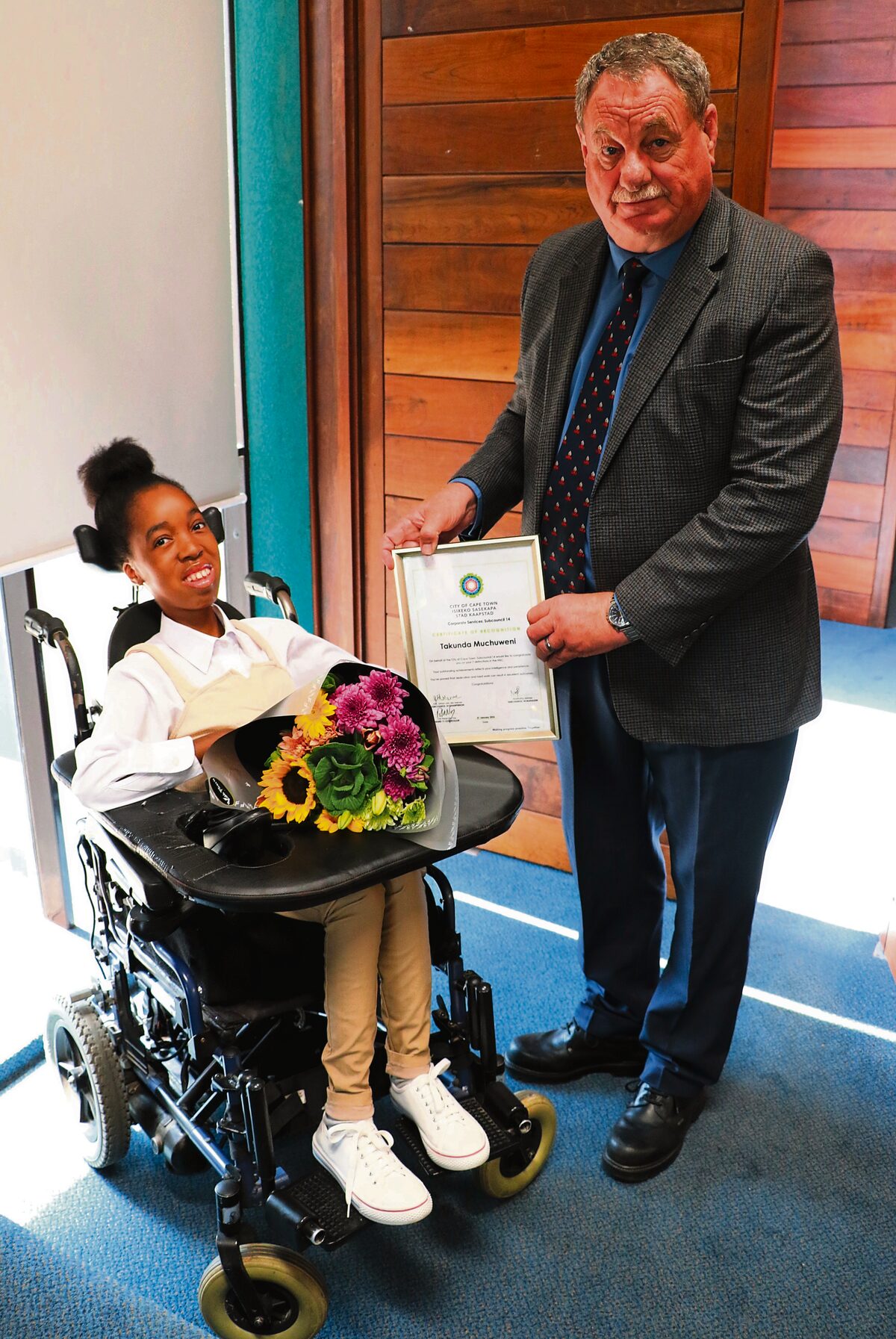 Subcouncil 14 chair Johannes van der Merwe and Takunda Muhuweni, top LSEN matriculant of 2025 who was presented with a certificate of recognition from the City of Cape Town.