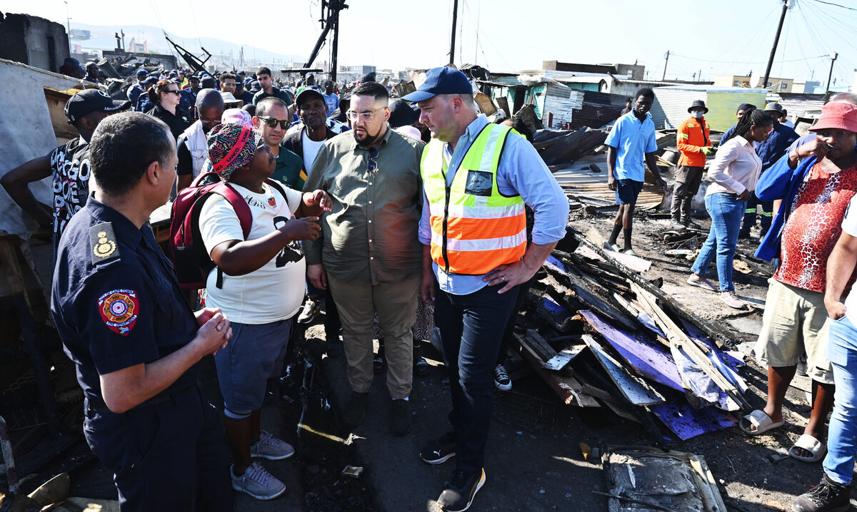 Mayor Geordin Hill-Lewis and Carl Pophaim visit fire-affected households in Dunoon.