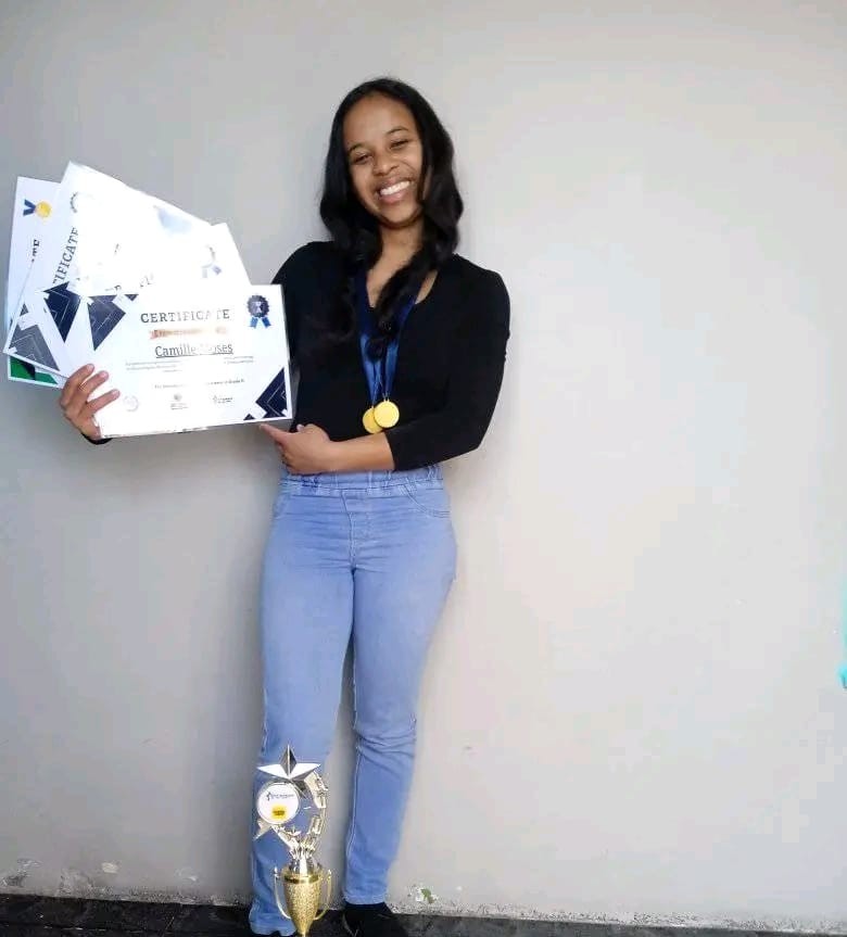 Camille Moses with all her certificates and trophees.