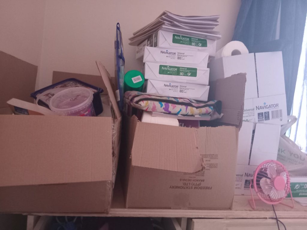 Stationery piled in boxes.