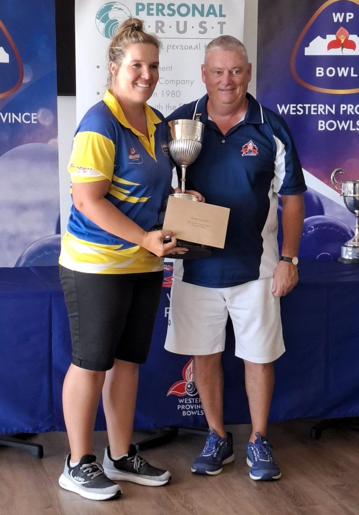 Protea star Anneke Scheepers receives her trophy from WP Bowls president, Tony Harland. Photo: Anina Black