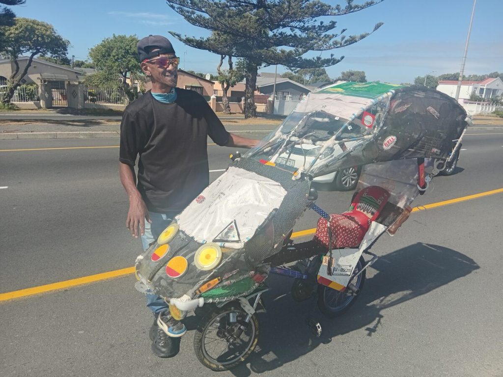 The rabbit breeder uses the Macgyvered bike to traverse the Cape Flats.