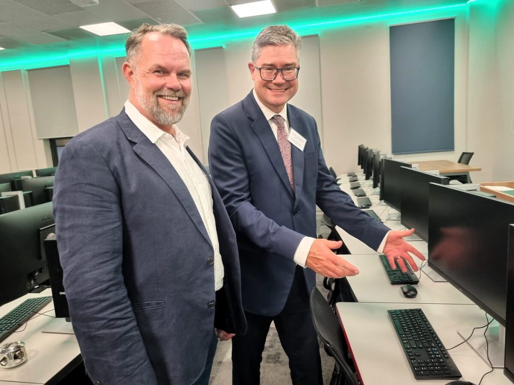 Prof Stan du Plessis (right), CEO of Stadio University, boasts about the modern IT technology with Pieter Koen, (left), chair of Durbanville Business. Photo: Esmé Erasmus