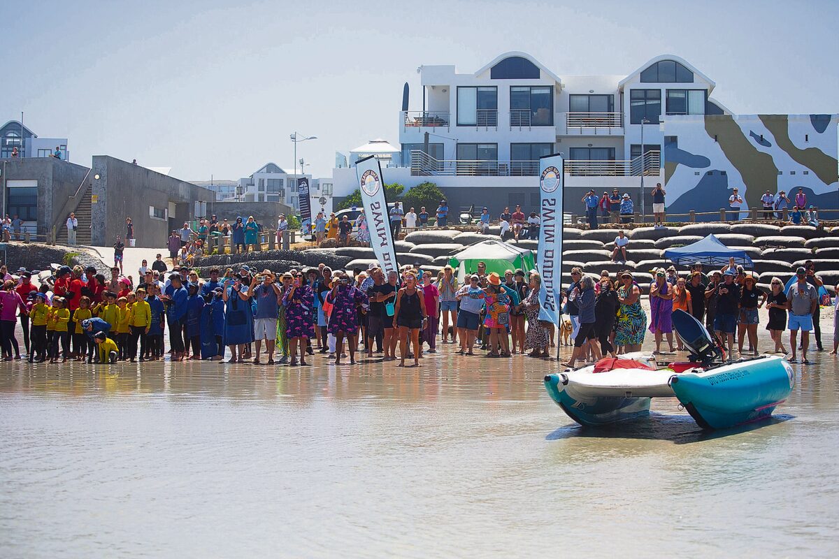 The Bloubergstrand community waiting on shore for John after his Robben Island crossing. Photo: Marzahn Botha