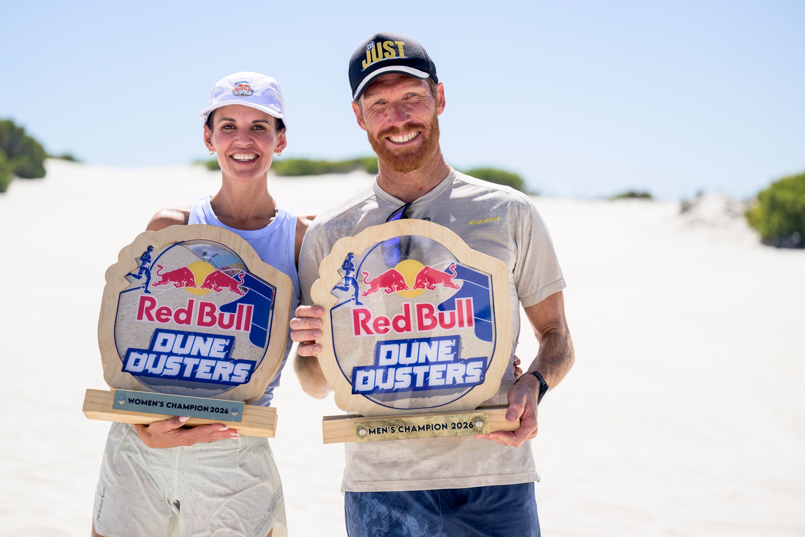 Louise Dippenaar and AJ Calitz pose for a portrait after winning Red Bull Dune Dusters.