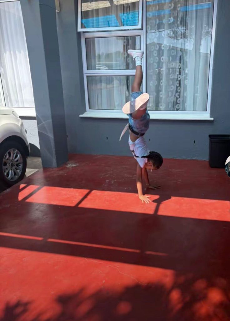 Xinah practices her moves.