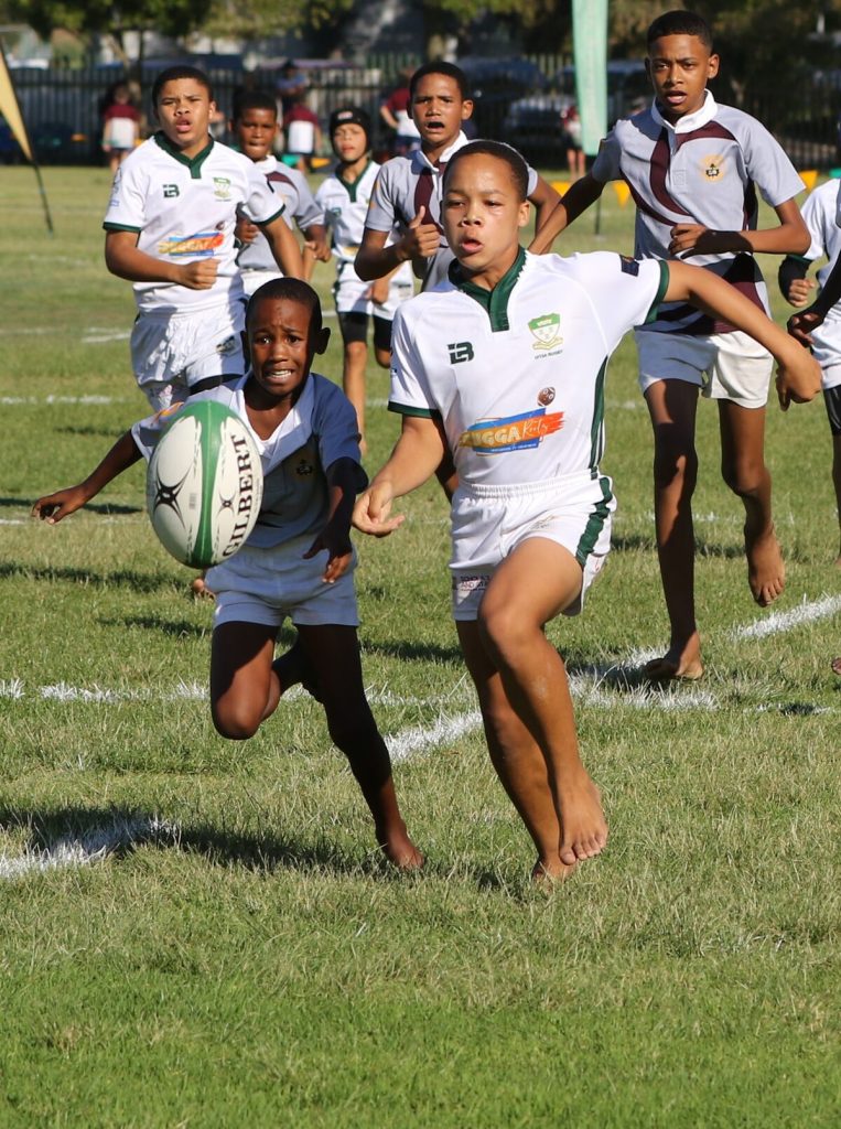 Jade Molifie from De Kuilen (right) chasing the ball he kicked in the u-13A match against Mamre Primary School.