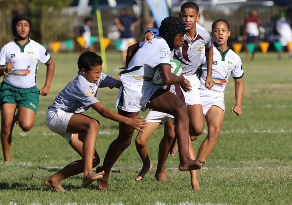 Lunathi Sodlodla (De Kuilen) trying his best to burst through the defense in the u-13A match against Mamre.