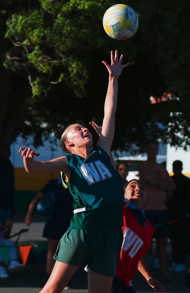 U-13A: Lieneke Pretorius (WA, Kenridge) trying to get the ball before Amra Martins (WD) from Goodwood Park.