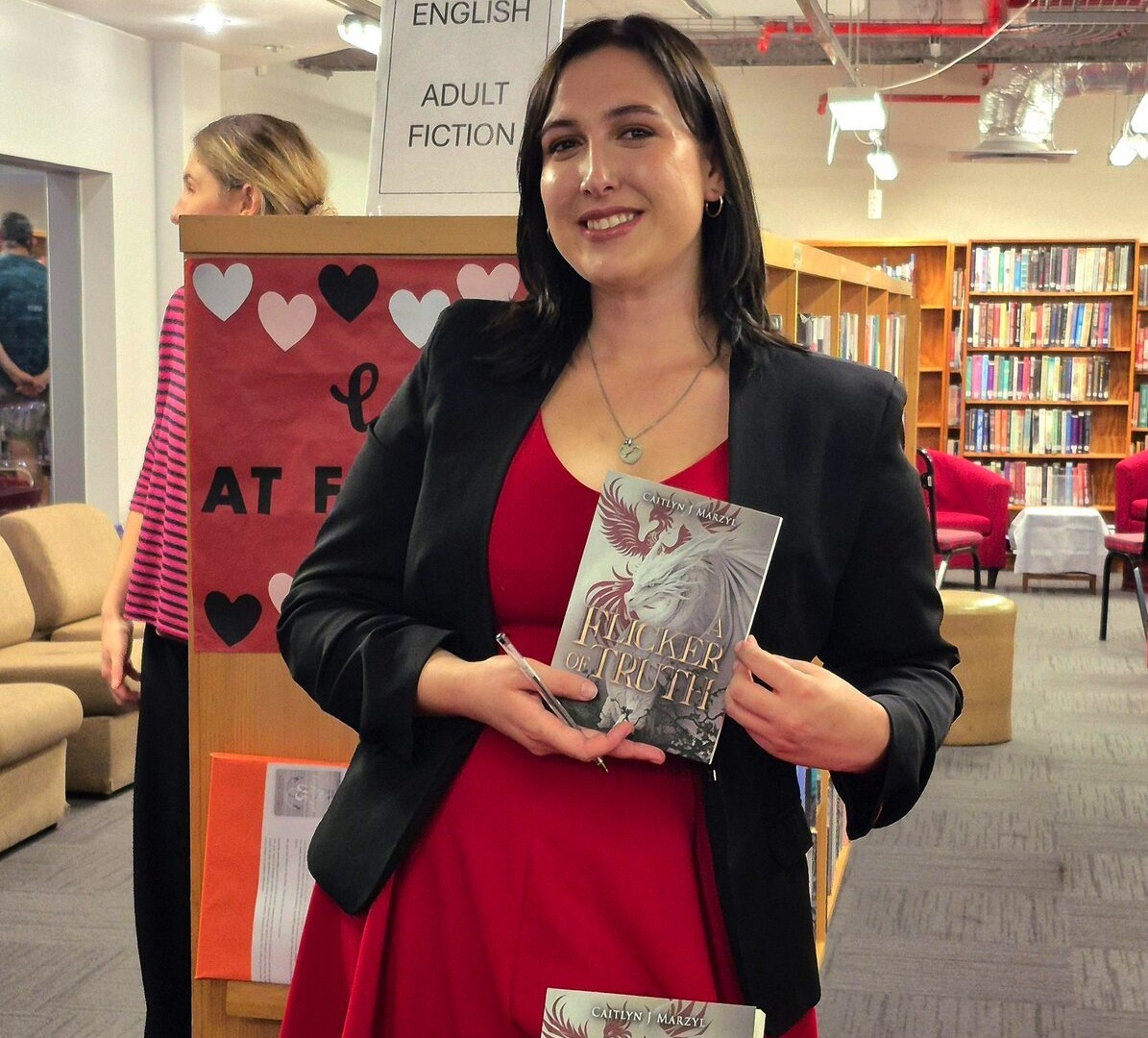 Author Caitlyn . Marzyl at Tyger Valley Library where "A Flicker of Truth" drew an enthusiastic crowd of over 30 readers.