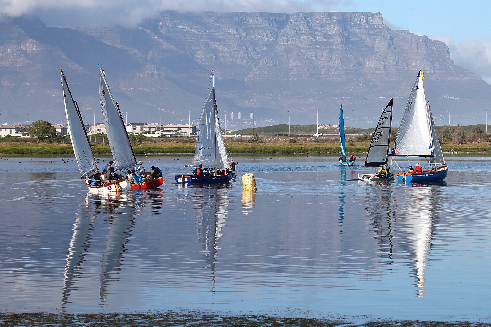 Sailors navigate near windless conditions during the MAC 24 Hour Challenge at Milnerton Aquatic Club. Photo: Colin Brown