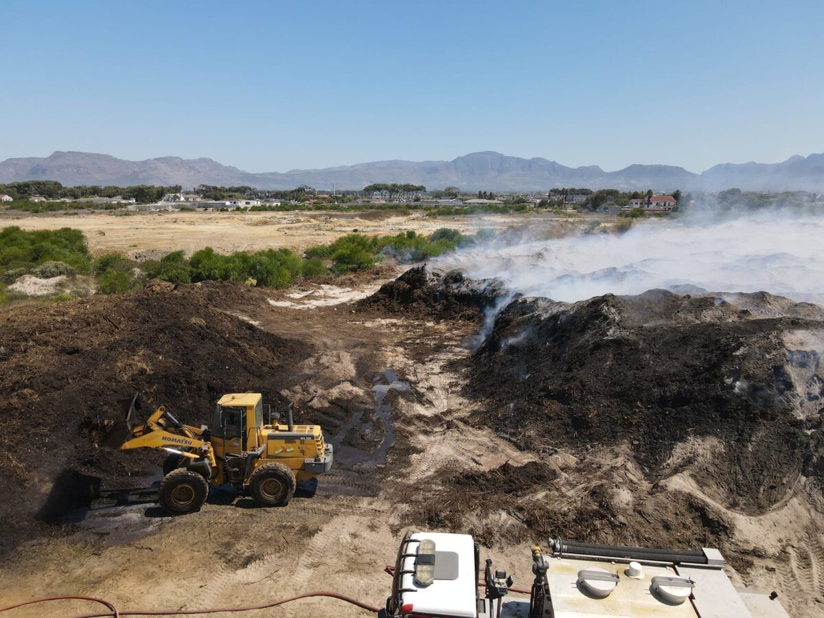 The farm's owner is assisting City firefighters to dig into the mound.