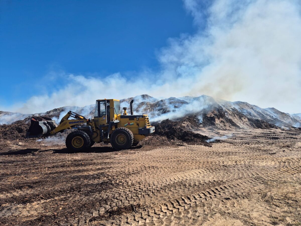 A huge pile of compost in Schaapkraal still smoulders days after the blaze started on Saturday.