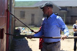 Tafelsig residents remove gang graffiti from a local park wall
