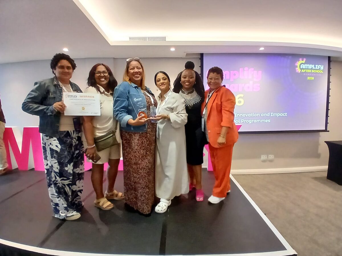 The team from Advance Edukos accepts their award.