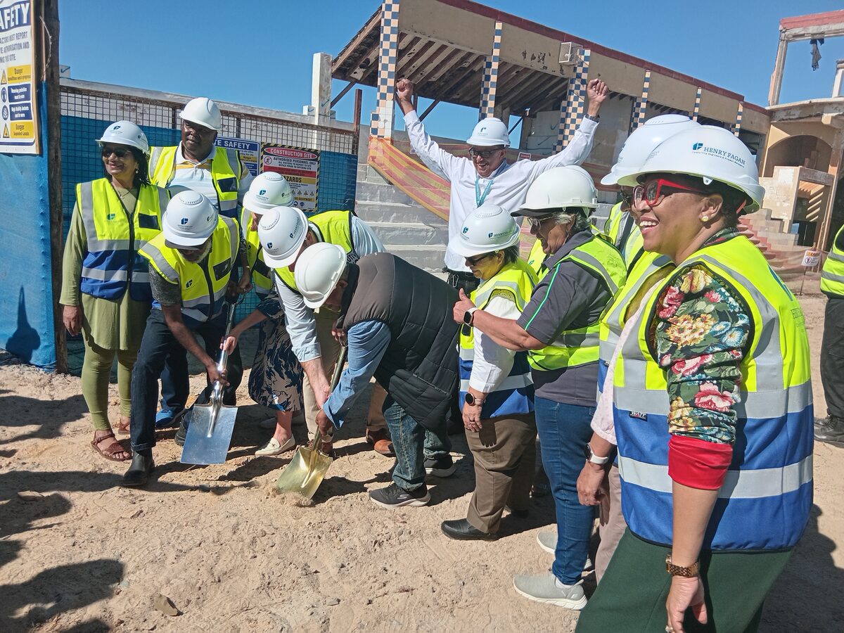 City councillors and Mayor Geordin Hill-Lewis take part in a ceremonial sod-turning event.