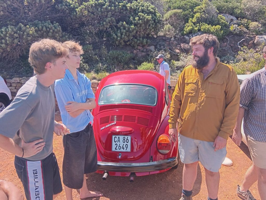 Presley Ofsowitz (18) and Luke Hare (19) of Fish Hoek chat to Seth Scott.