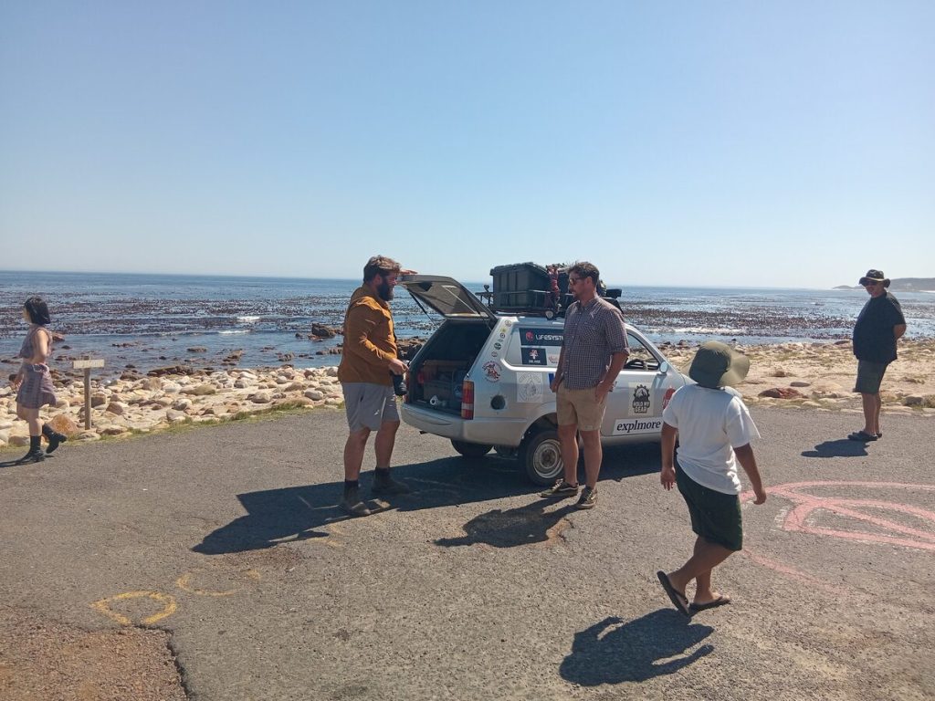 Seth Scott and Ollie Jenks park at the Cape of Good Hope after driving from London after 91 days on the road.
