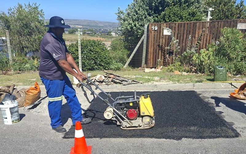 A City of Cape Town worker fixing a trench.