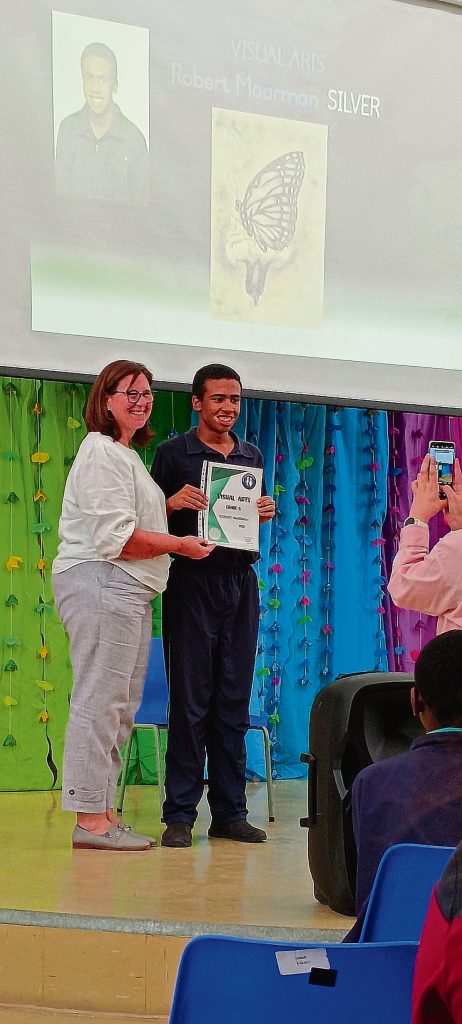 Robert Maarman (here age 16) receiving a silver certificate for visual arts at the Courage Eisteddfod,