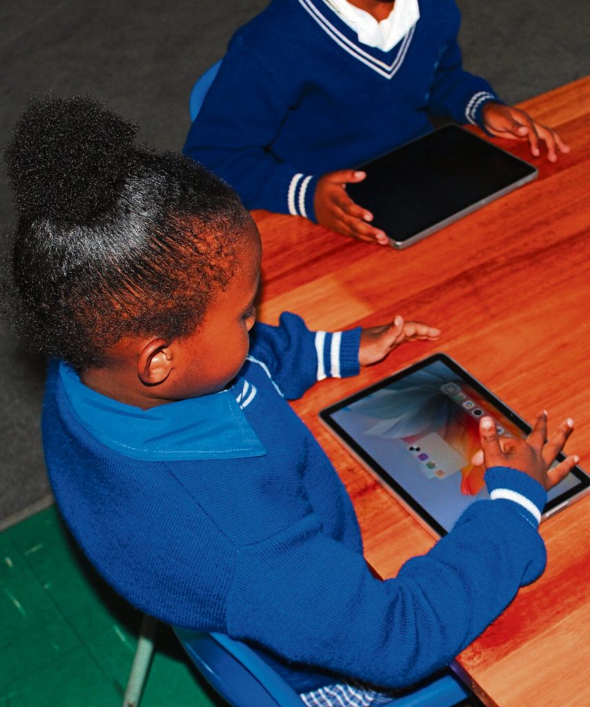 A learner from Vissershok Primary School is trying her new skills on a tablet. Photo: Caroline Steenekamp