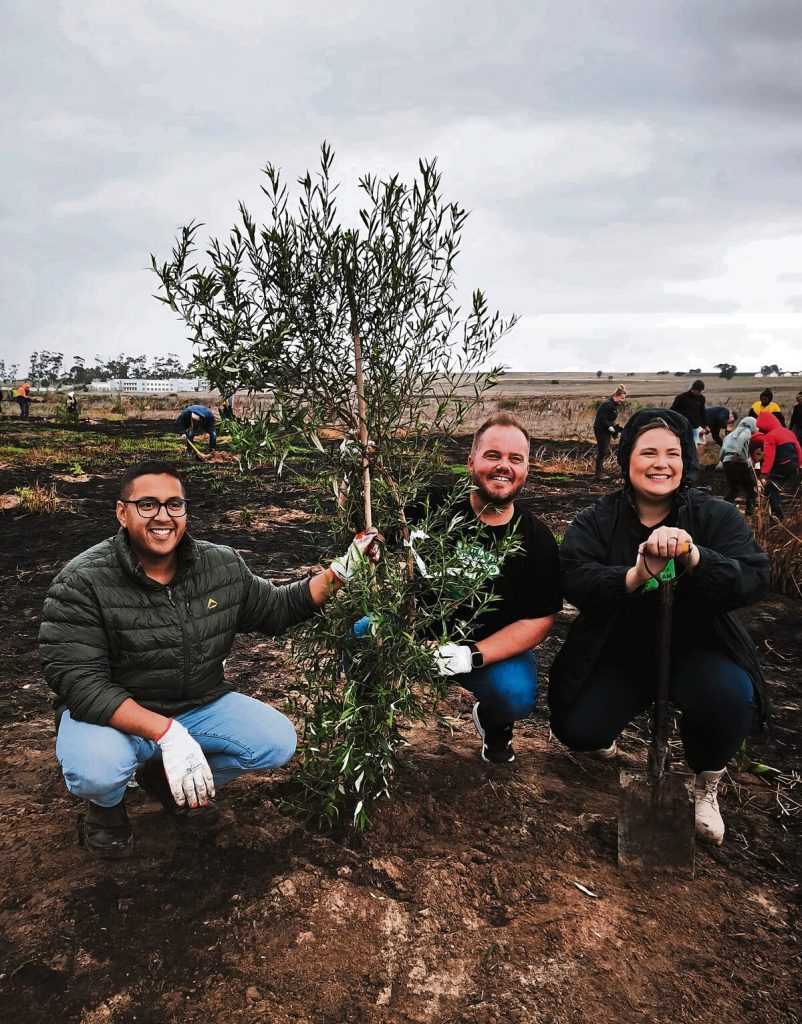 From left are Dr Zahid Badroodien (Mayco member for water and sanitation), Francois Berry (Ward 105 councillor) and Danielle Cronje (director and co-founder of MRCT) planting a tree at the Mosselbank River. Photo: De Wett Cronje