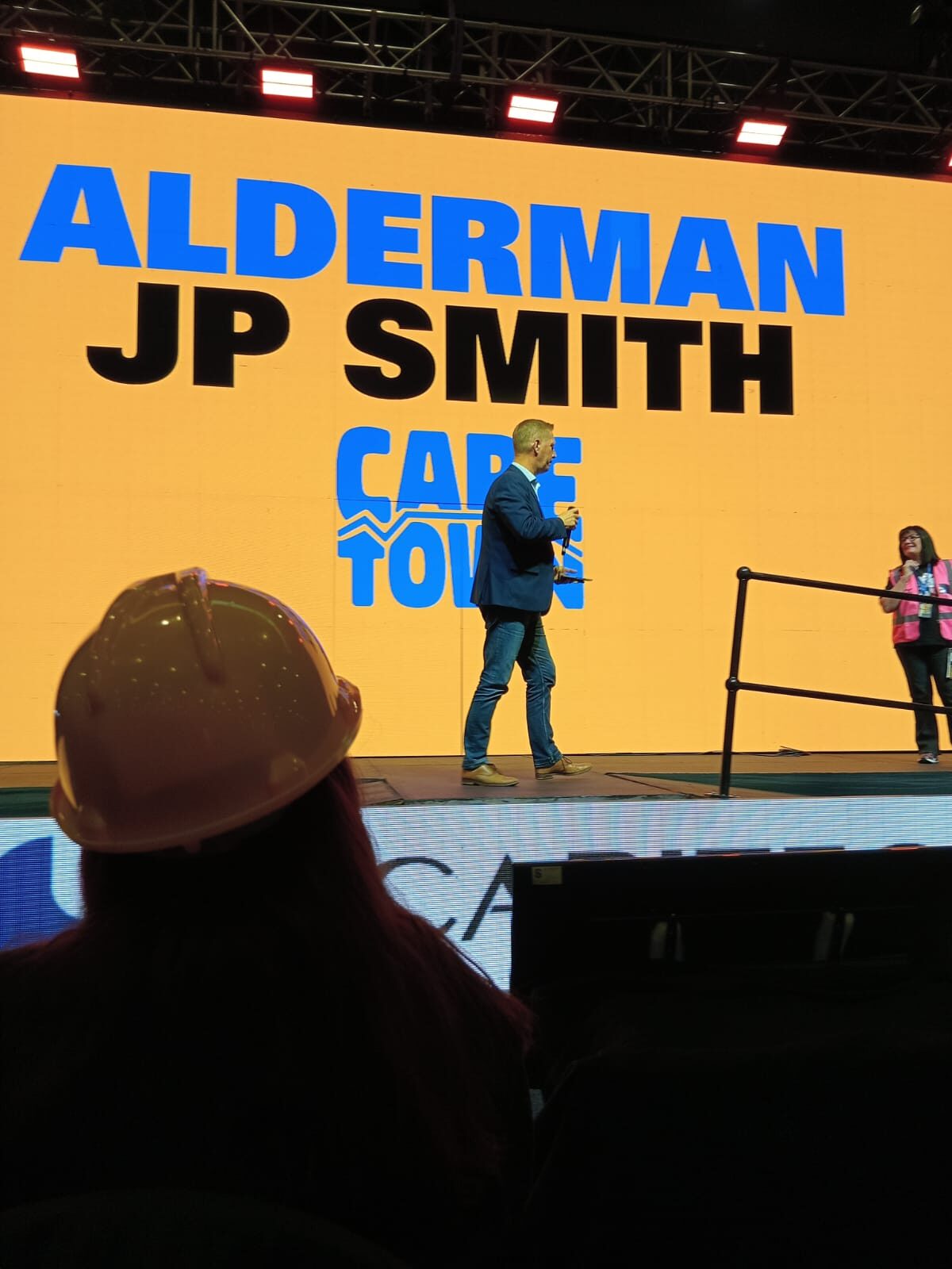 JP Smith hands the mic off to event organiser Carol Weaving.