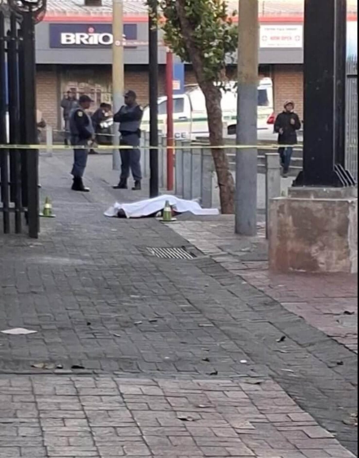 Police cordon off the scene where a man shot near Hazeldene taxi rank yesterday morning.