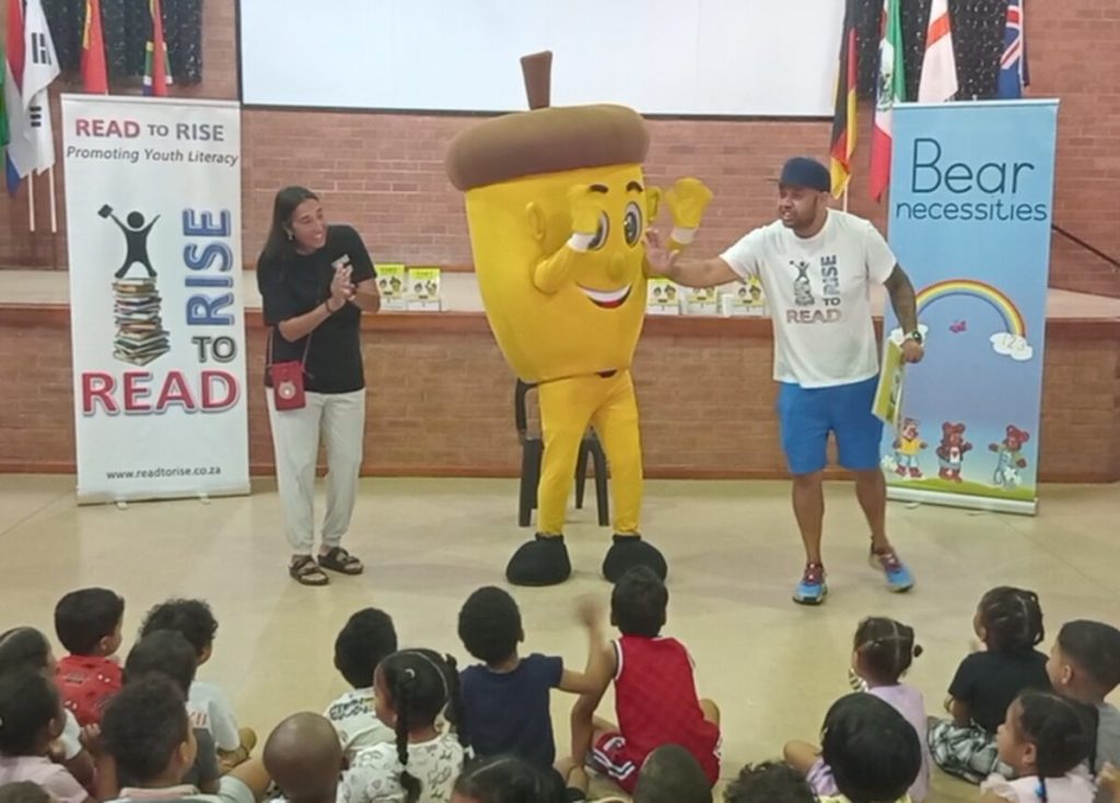Oaky the Acorn makes an appearance at a book drop off.