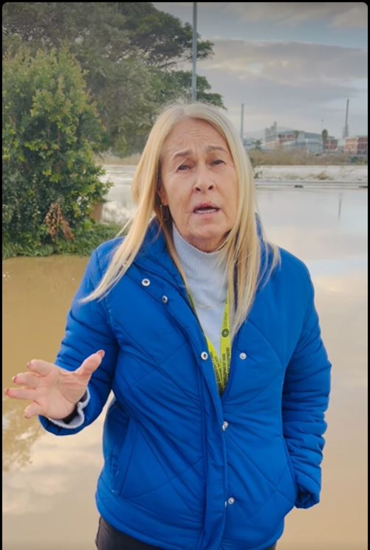 Councillor Sue van der Linde assesses flood damage along Hopley Road on Wednesday morning.