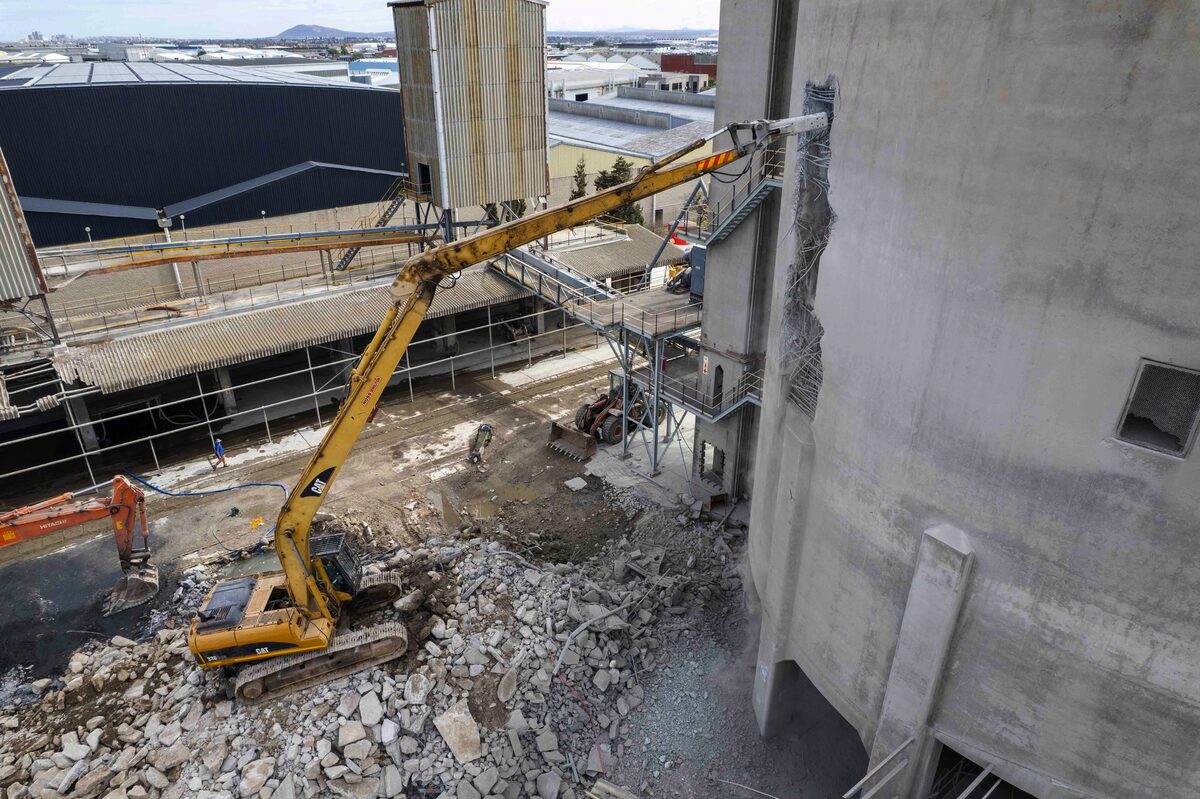 Heavy machinery levels the PPC tower as redevelopment begins in Montague Gardens.