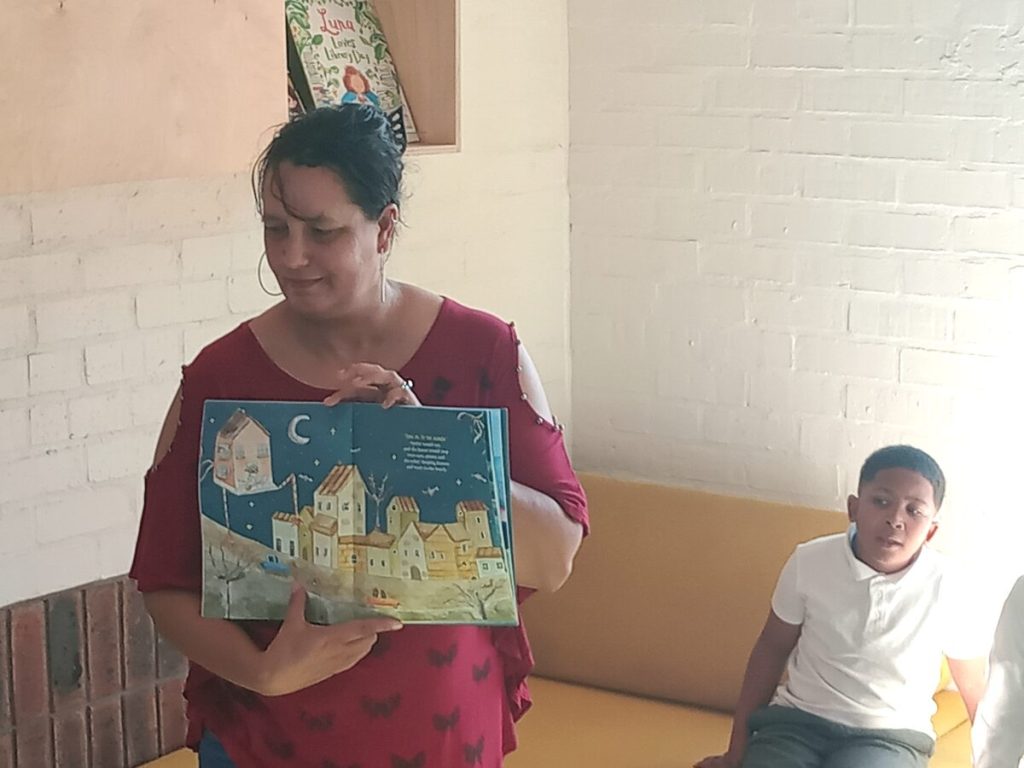 Lauren O'Connor-May of Strandfontein reads from her book Dream House Adventures.