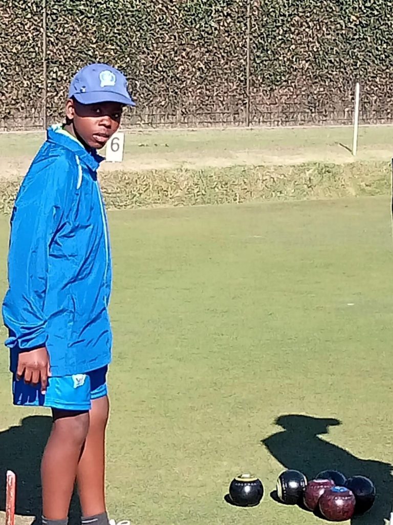 Thando Mraji (13) in action on the bowling green.