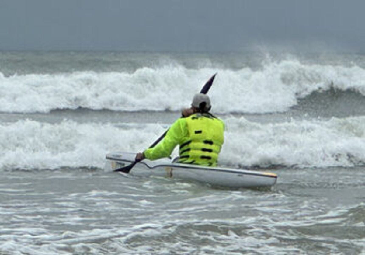 Emergency crews rescue a missing paddler from rocks off the Blouberg coastline after an extensive search operation. Photo: NSRI.