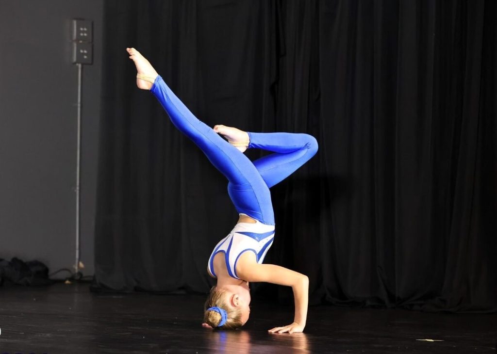 Ava Crous performing a headstand.