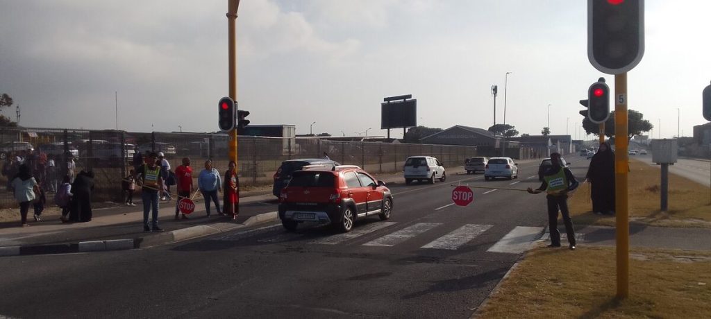 A photo taken by Richard Small of a vehicle ignoring the booms and traffic lights.