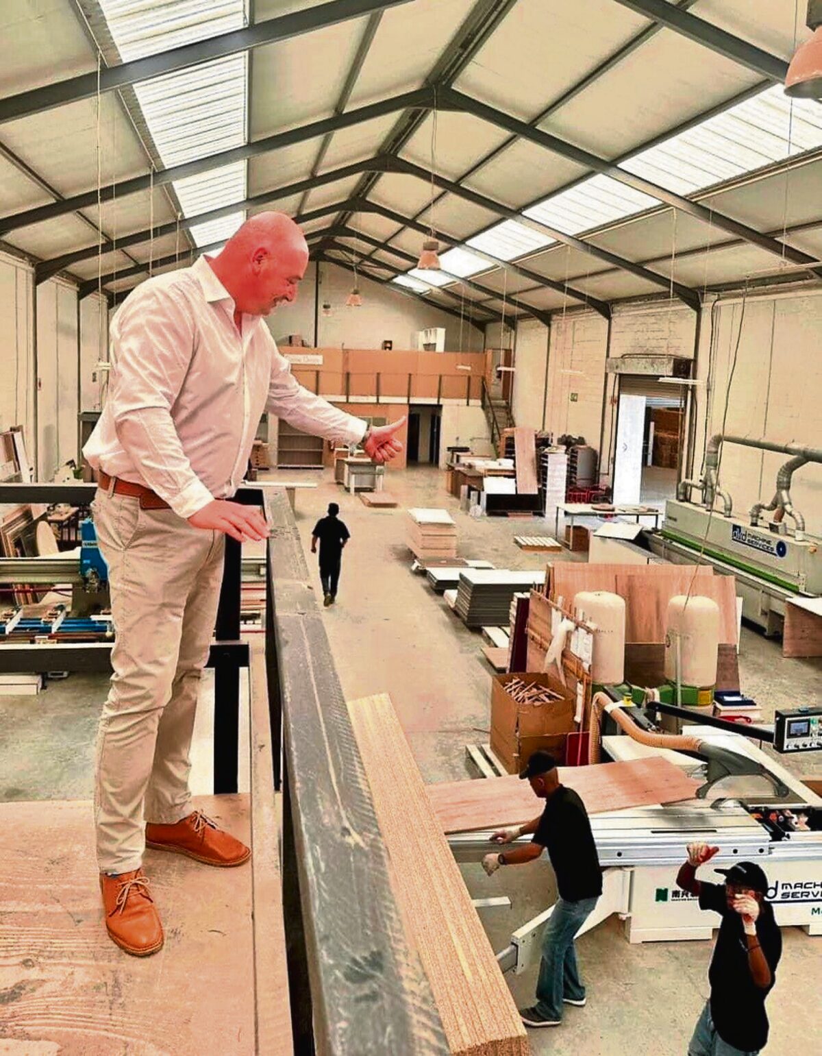 James Vos, Mayoral Committee Member for Economic Growth, at a clothing production company.