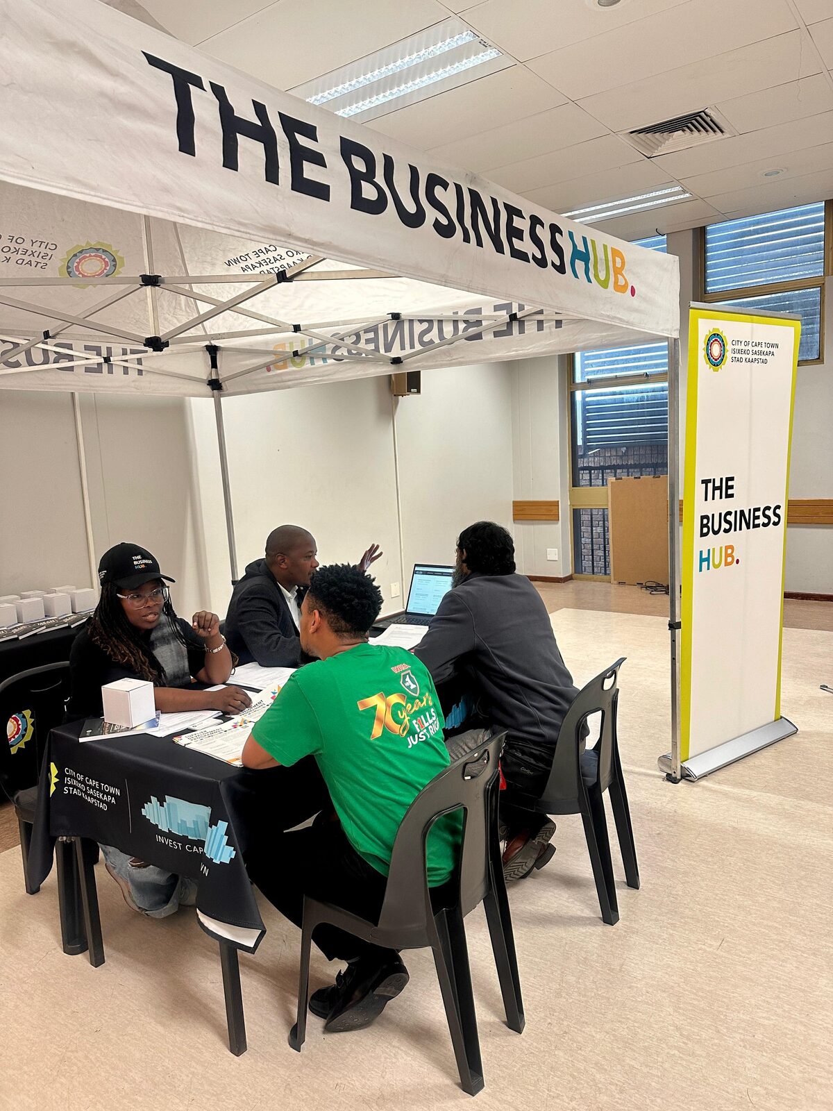 Nasisipho Phama and Yonalisa Mzombi from the Business Hub engage with entrepreneurs at the Bellville activation.