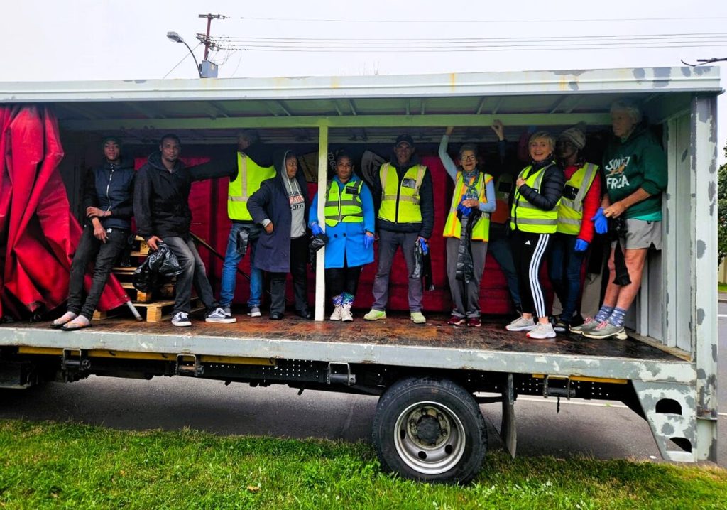 Volunteers were transported in the back of the truck to the various areas.