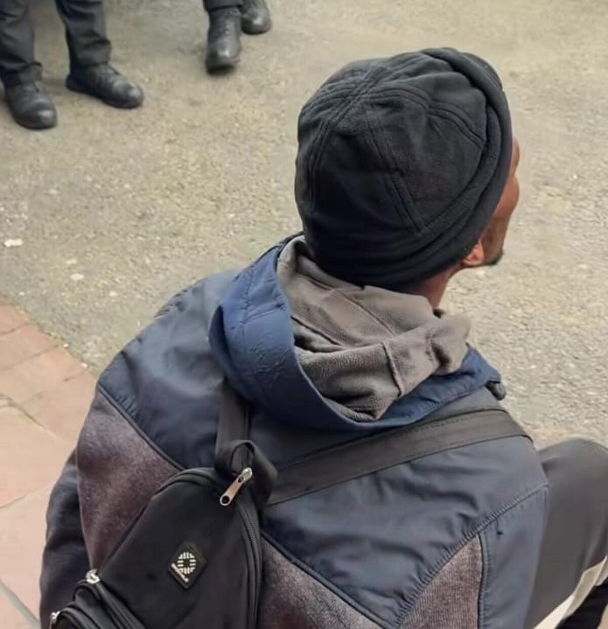 The suspect was found sitting outside a Kraaifontein shop.