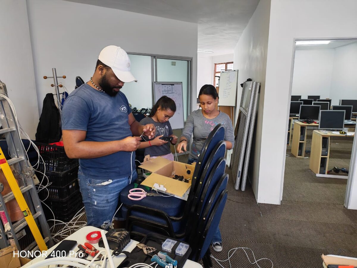 Learners getting hands-on experience with network cabling during the school holidays at Knights Innovation Support Centre in Strandfontein.