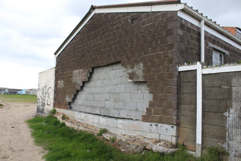The cracking foundation at the house in Beacon Valley which is falling apart.