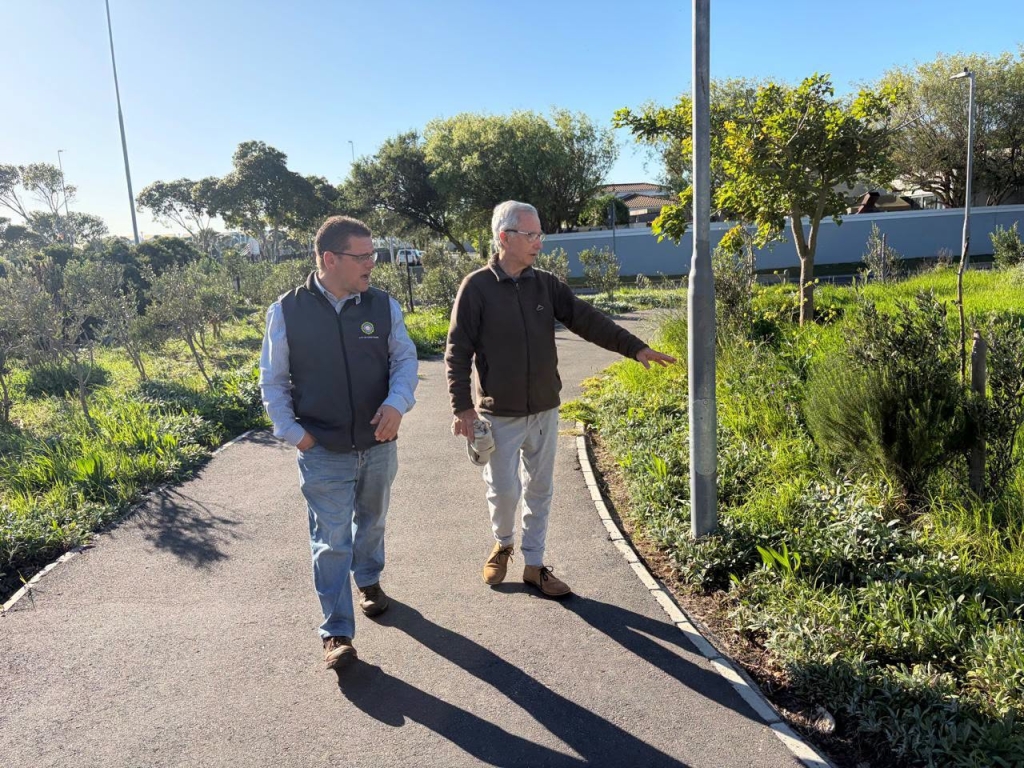 Ward councillor Jonathan Mills and local resident Terry McDonogh enjoy a walk through the flourishing Marlborough Park.