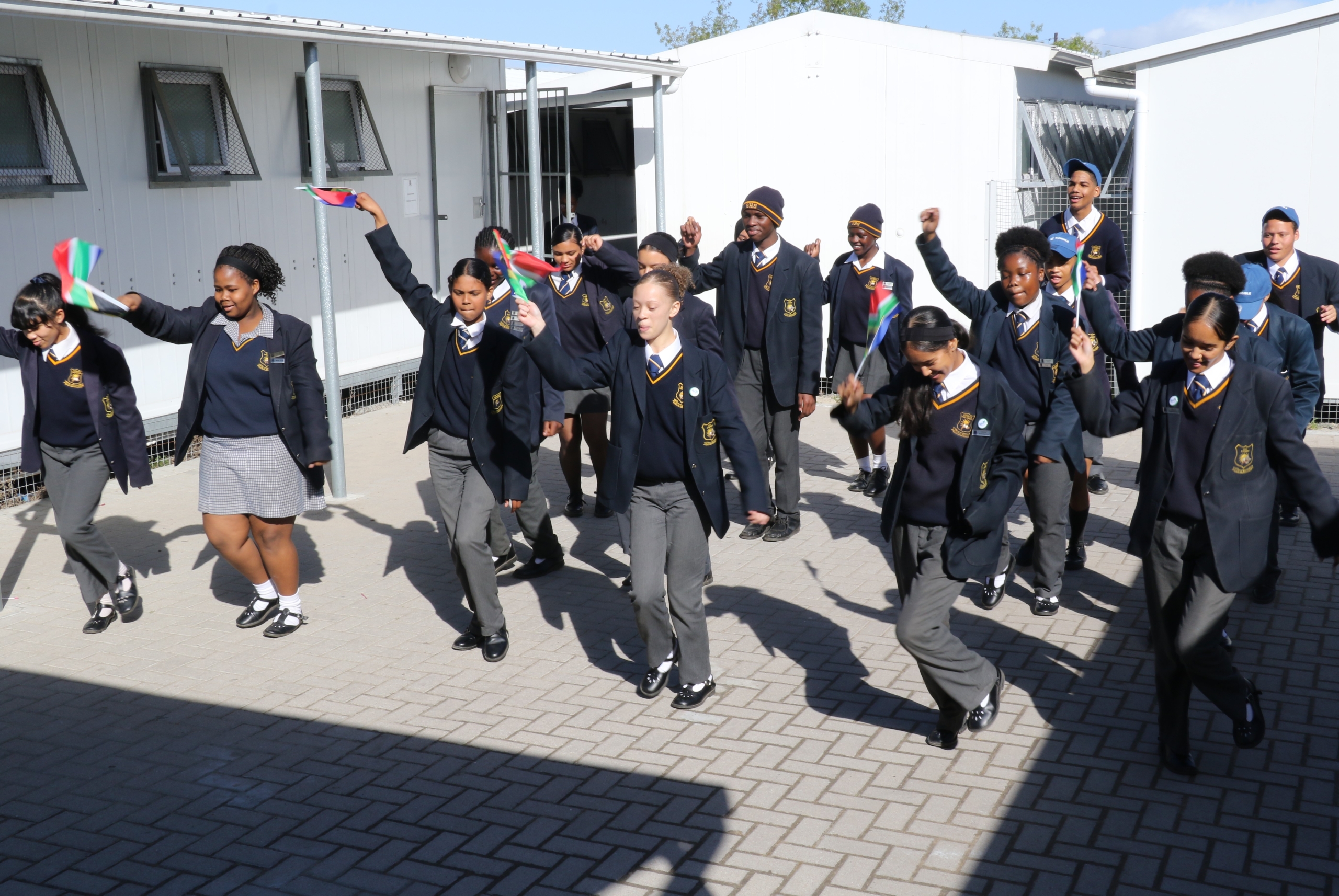 Learners from Soneike High School's Coding Club dancing in celebration.