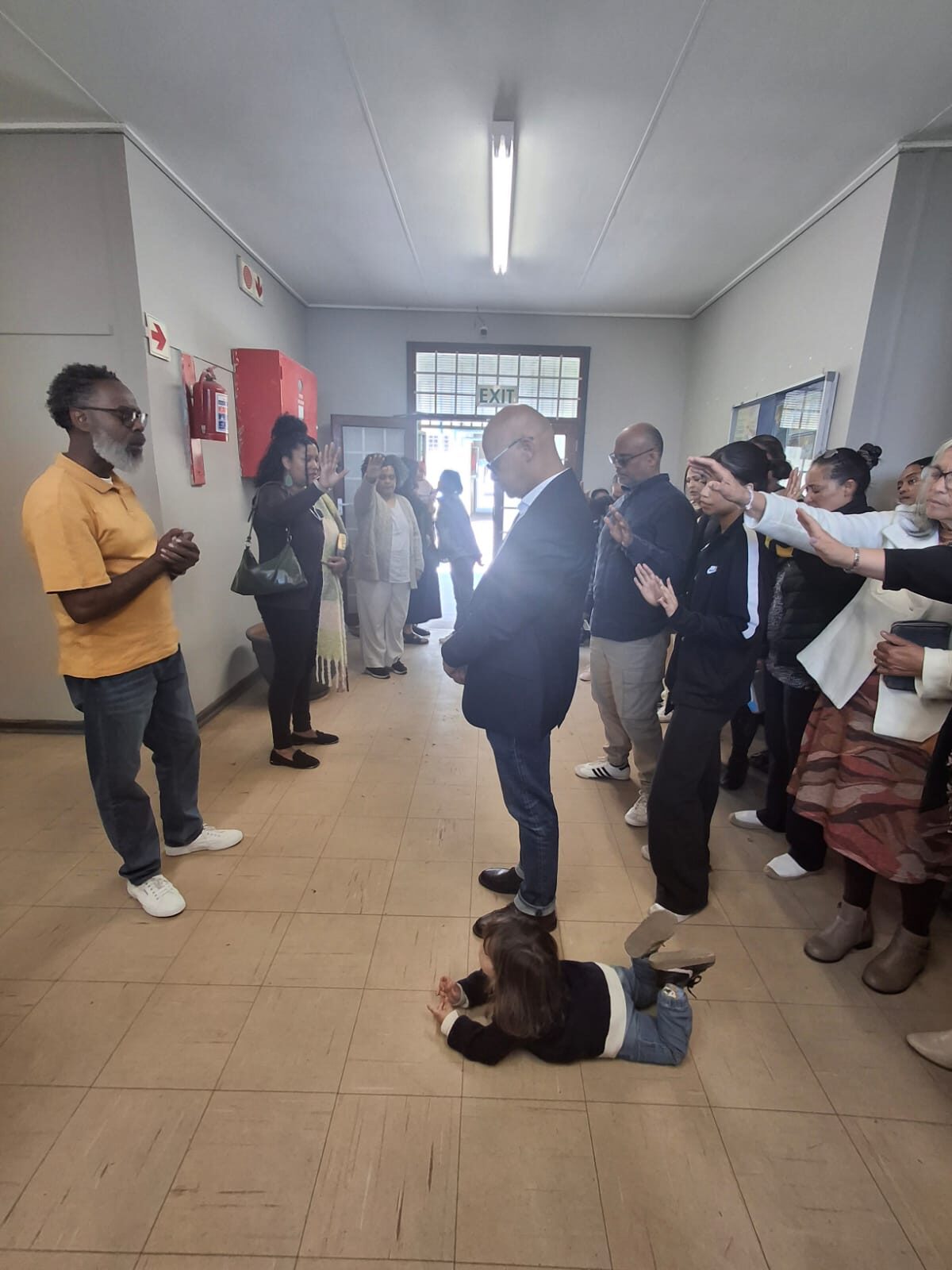 Ward councillor Elton Jansen leads a prayer service at Strandfontein High School.