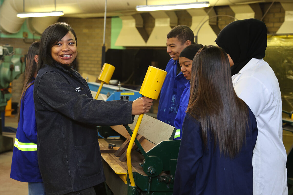 Athina Dennis with learners at Oval North High School.