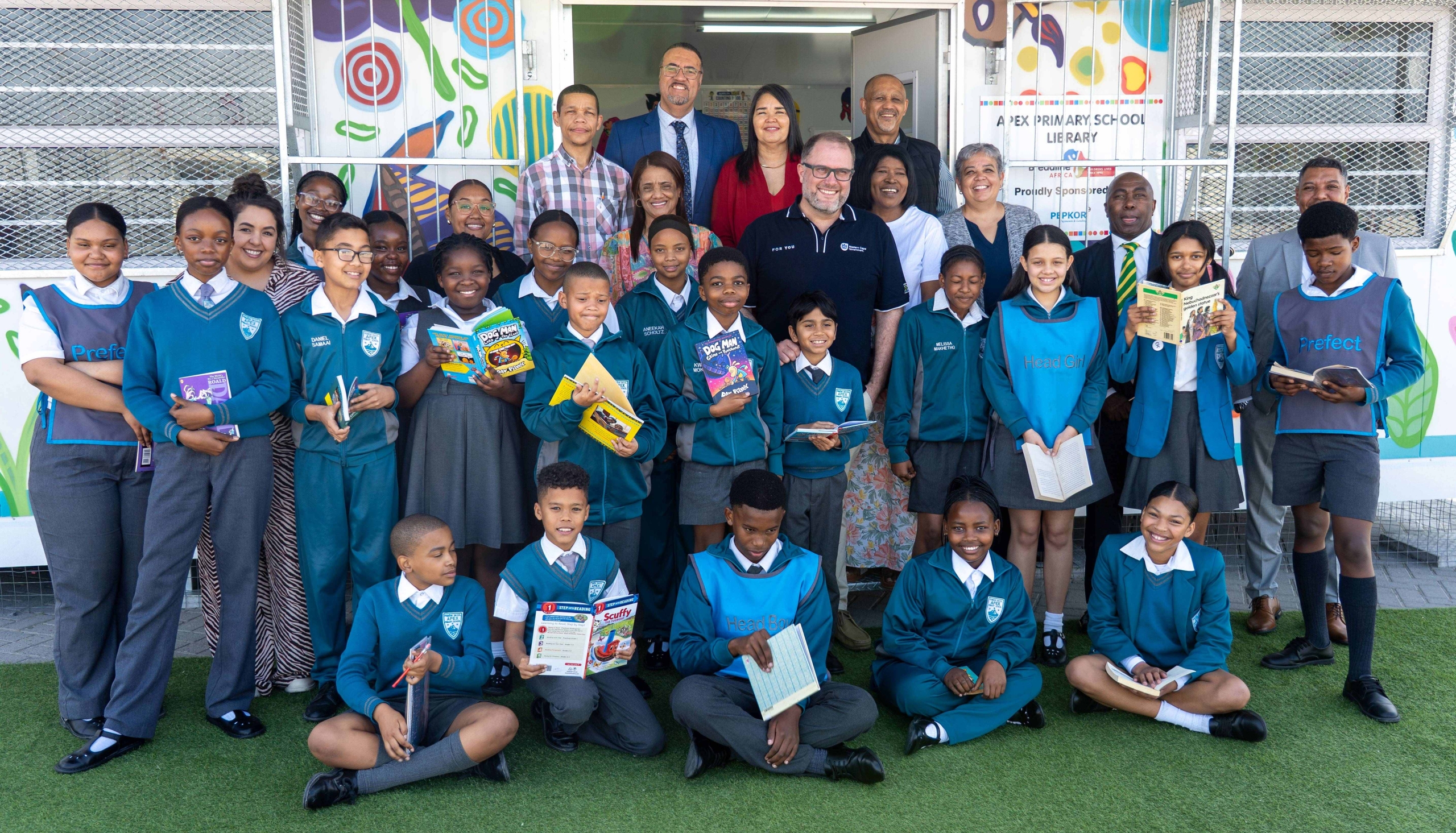 Western Cape education minister Jaco Londt reads with learners from Apex Primary School in Eerste River.